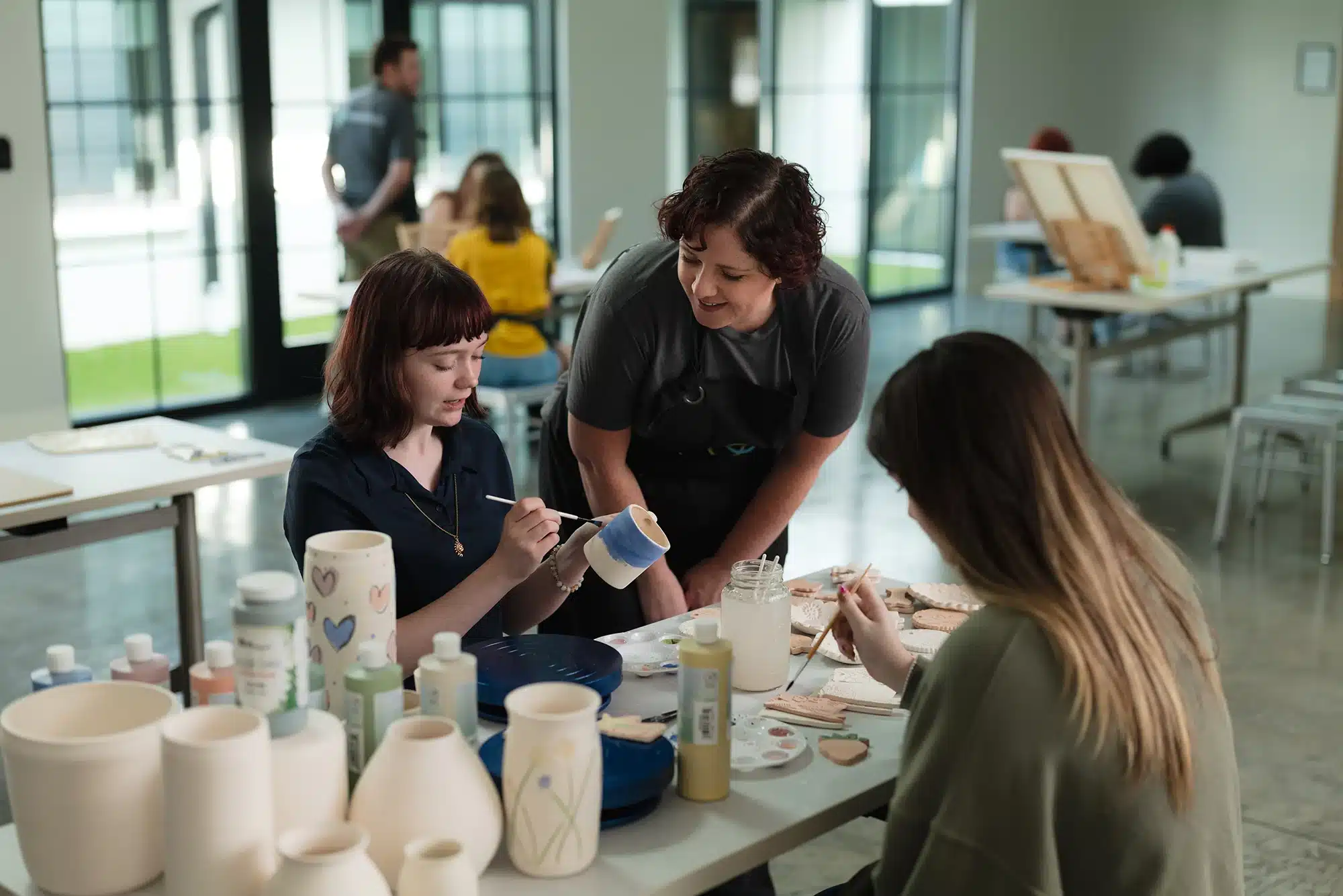 Adolescent Eating Disorder Treatment 9 teens participating in a group art therapy activity.